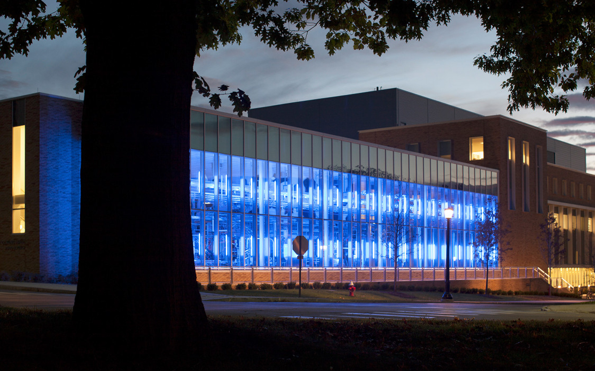 Stocking Hall research lab lit up blue at dusk