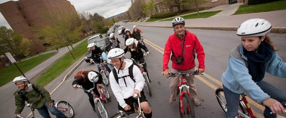 Group biking together wearing helmets