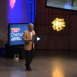 Mike Hoffmann lectures on stage at TedX in Chemung River