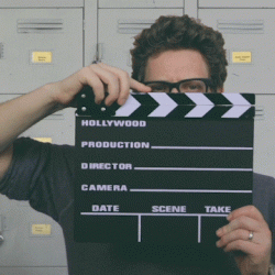 Person opening and closing a clapperboard-the thing a film director uses when they say "cut!"