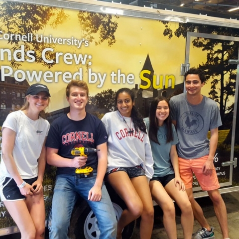 Students and alumni from the Cornell University Sustainability Design’s Solarize team take short break in this image from building the solar-powered trailer