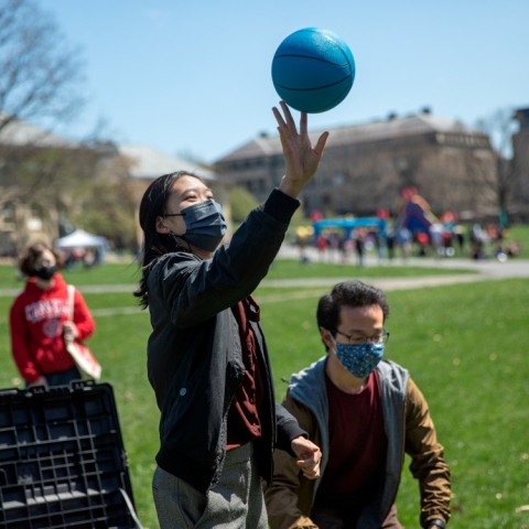 Students celebrate sustainability wellness playing volleyball in the sun on Arts Quad