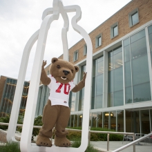 The Big Red Bear standing in a milk jug sculpture outside Stocking Hall.