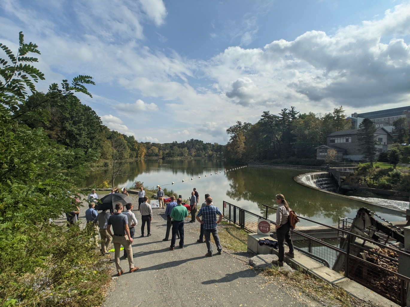 A group gathers next to Beebe Lake to celebrate the hydroplant relicensing