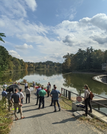 A group gathers next to Beebe Lake to celebrate the hydroplant relicensing